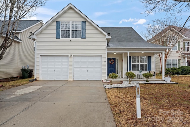 front of property featuring a garage and covered porch