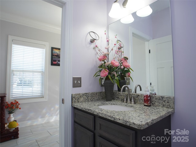 bathroom with vanity and crown molding