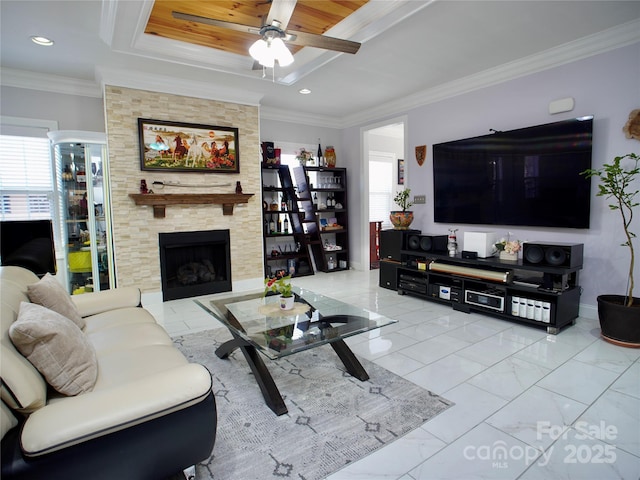 living room with crown molding, a fireplace, and ceiling fan