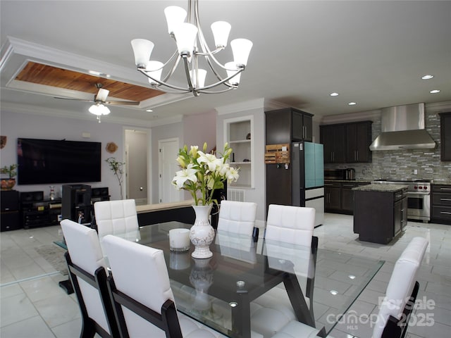 tiled dining area featuring built in shelves, ceiling fan with notable chandelier, and ornamental molding