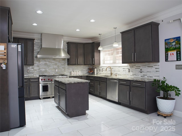 kitchen featuring decorative backsplash, wall chimney exhaust hood, stainless steel appliances, and a kitchen island