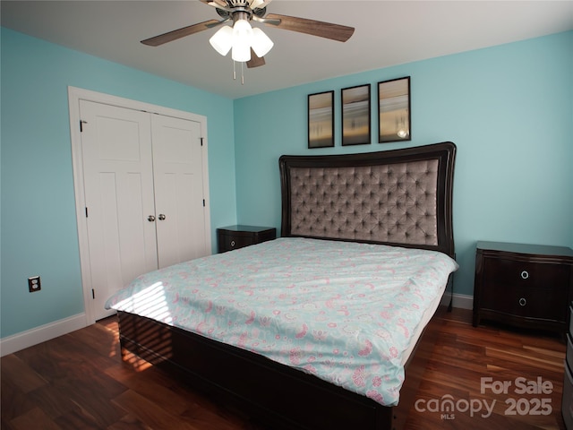 bedroom featuring ceiling fan, dark wood-type flooring, and a closet