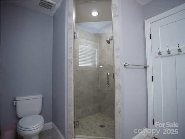 bathroom with toilet and walk in shower