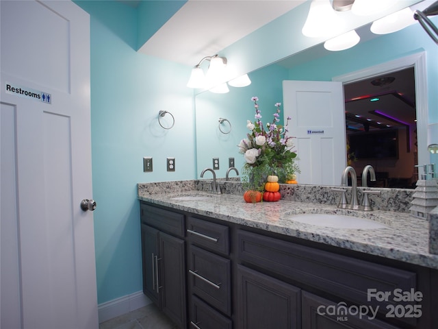 bathroom featuring tile patterned floors and vanity