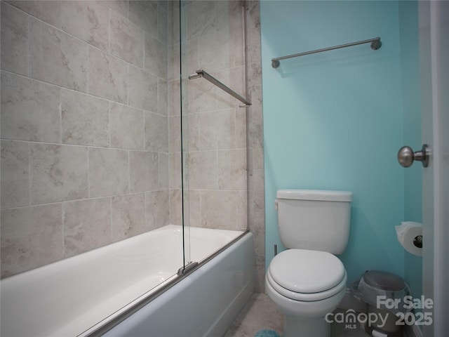 bathroom with toilet and enclosed tub / shower combo