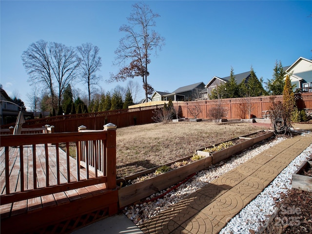 view of yard featuring a wooden deck