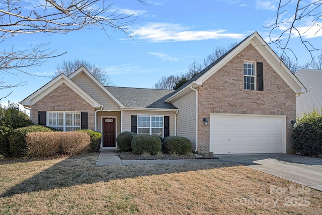 view of front of house featuring a garage and a front lawn