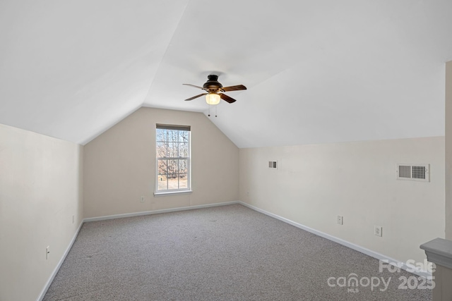 bonus room with vaulted ceiling, ceiling fan, and carpet