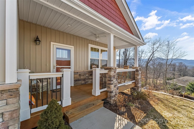 property entrance with covered porch and a mountain view