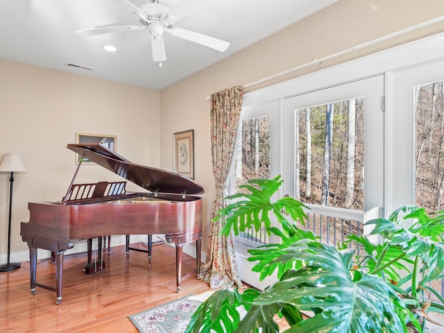 miscellaneous room with hardwood / wood-style floors and ceiling fan