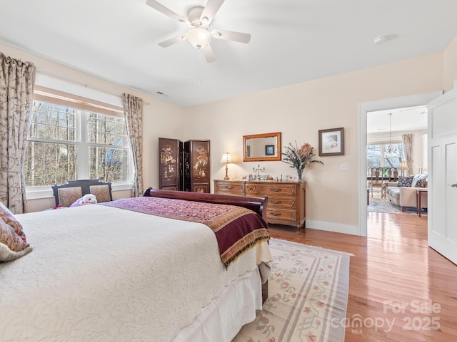 bedroom featuring ceiling fan and hardwood / wood-style floors