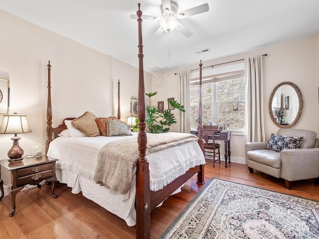 bedroom featuring ceiling fan and hardwood / wood-style floors