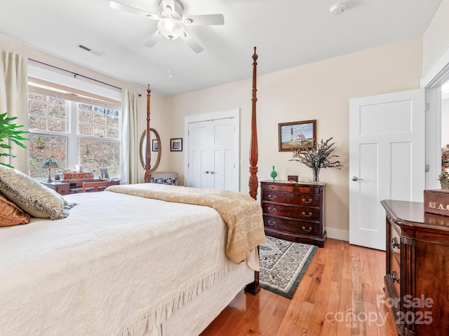 bedroom with light wood-type flooring and ceiling fan