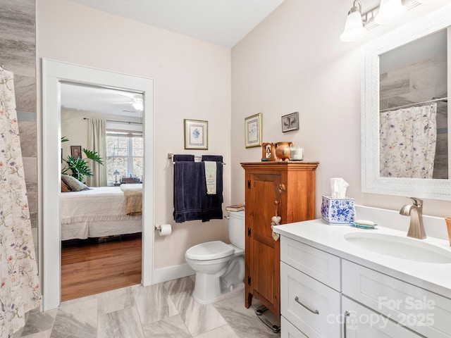 bathroom featuring toilet and vanity