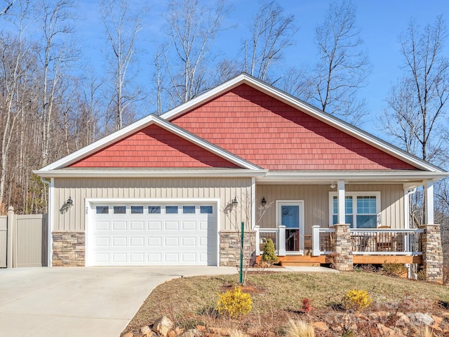 craftsman house with a porch and a garage