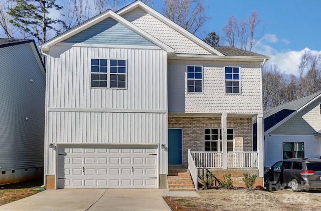 view of front facade featuring a garage and covered porch