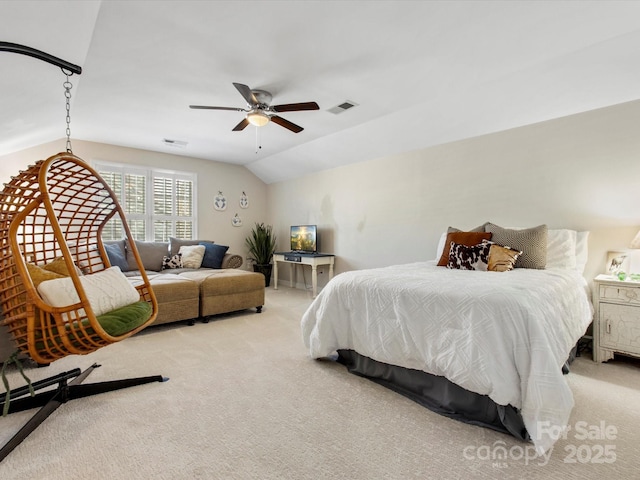 bedroom with ceiling fan, light colored carpet, and lofted ceiling