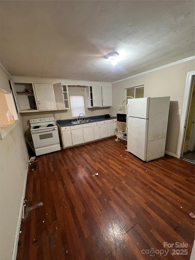 kitchen with white cabinetry, sink, dark wood-type flooring, and white appliances