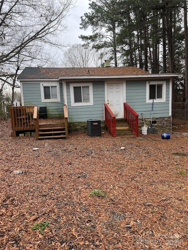 back of house with cooling unit