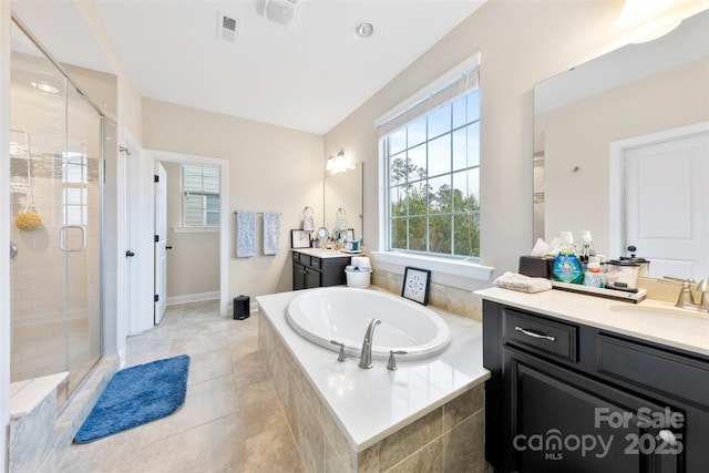 full bath featuring a sink, two vanities, a shower stall, a garden tub, and visible vents