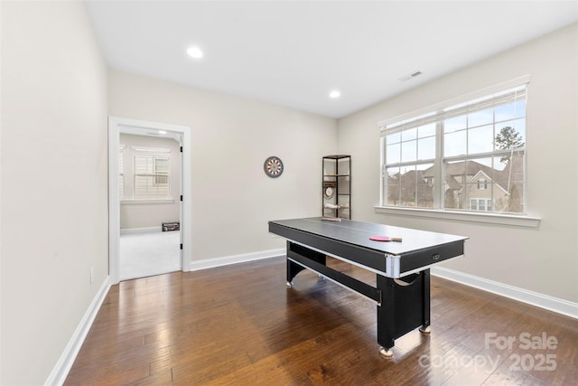 recreation room featuring hardwood / wood-style floors, visible vents, baseboards, and recessed lighting