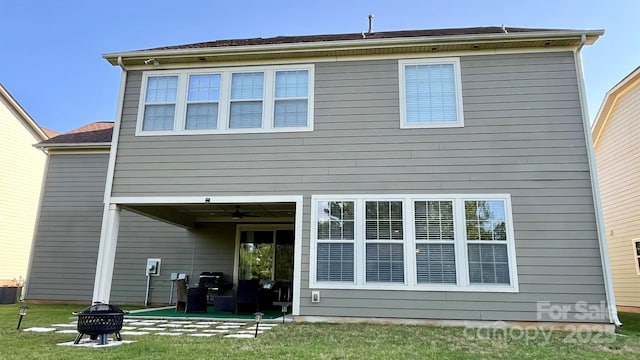 11519 Sweet Birch Ln, Charlotte, NC 28278 - back of house with an outdoor fire pit, a lawn, a patio area, central AC, and ceiling fan