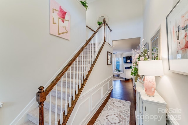 staircase featuring hardwood / wood-style flooring