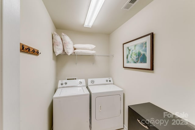 clothes washing area with independent washer and dryer