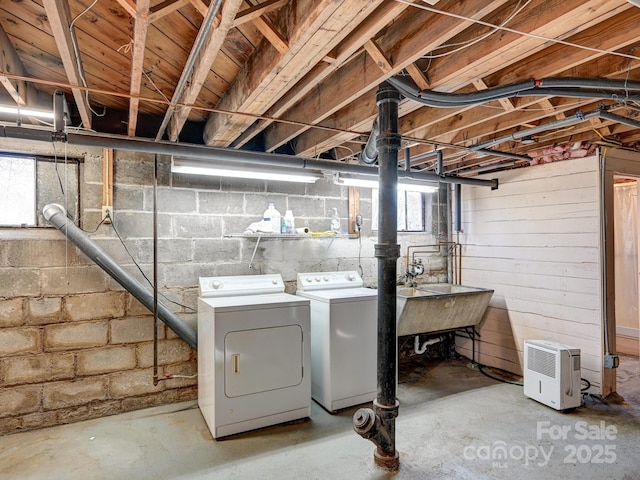 laundry area with plenty of natural light and washing machine and dryer