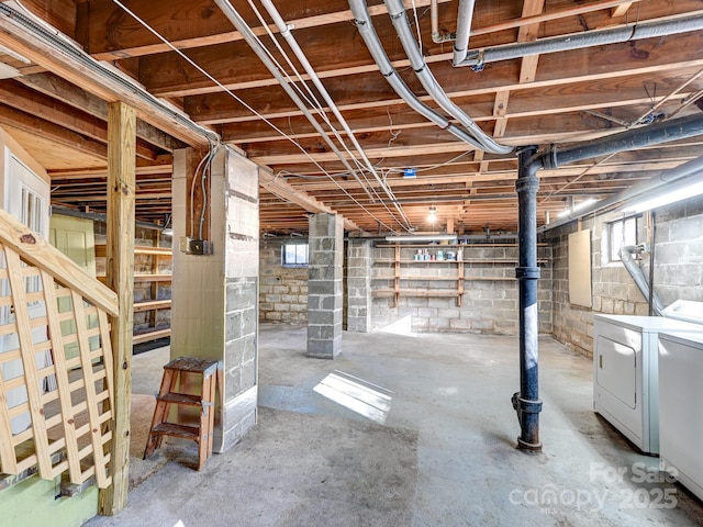 basement featuring washing machine and clothes dryer