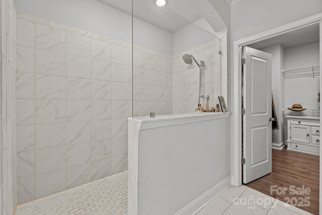 bathroom with a tile shower