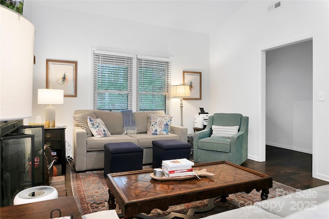 living room with dark hardwood / wood-style floors