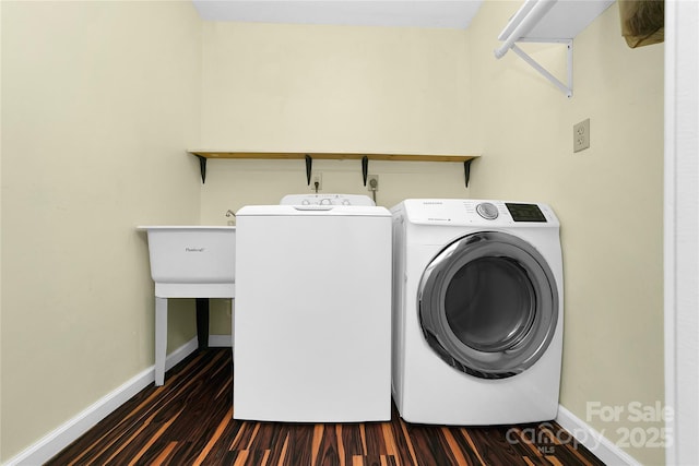 washroom featuring washer and clothes dryer