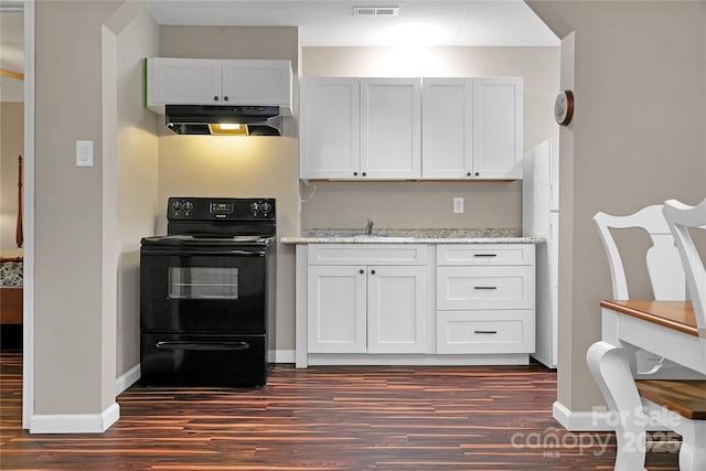 kitchen with white cabinetry, black range with electric cooktop, and light stone counters