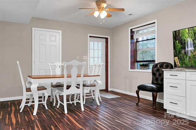 dining room featuring ceiling fan and dark hardwood / wood-style flooring