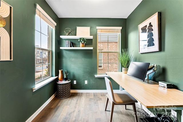 home office with hardwood / wood-style floors