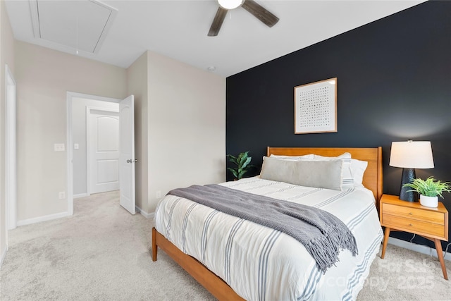 bedroom with ceiling fan and light carpet