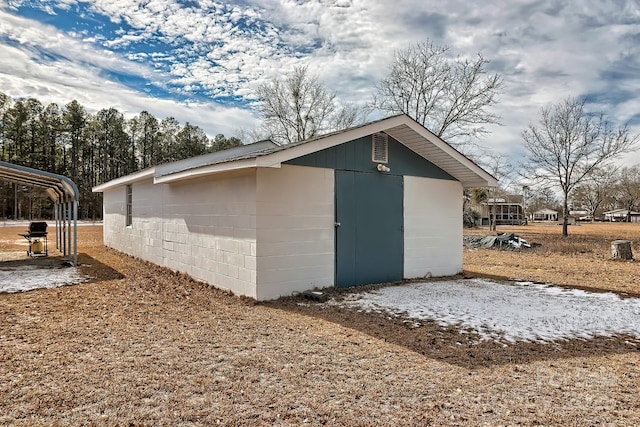 view of outdoor structure with a carport