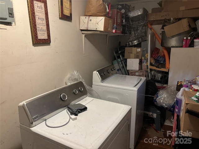 laundry area with washing machine and dryer