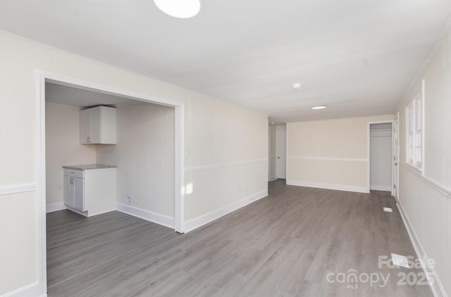 spare room with wood finished floors