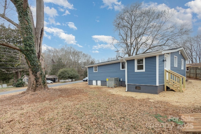 view of home's exterior with central AC unit