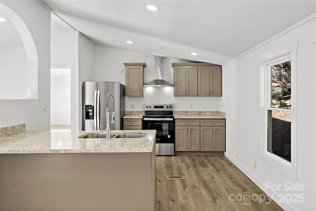 kitchen featuring wall chimney exhaust hood, stainless steel appliances, sink, kitchen peninsula, and vaulted ceiling