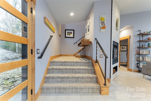 stairs featuring tile patterned floors