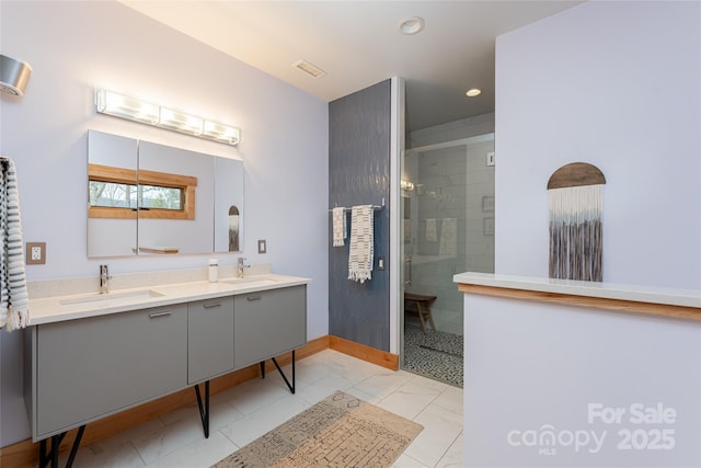 bathroom with vanity and an enclosed shower