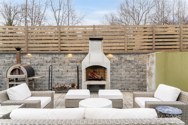 view of patio / terrace with an outdoor fireplace