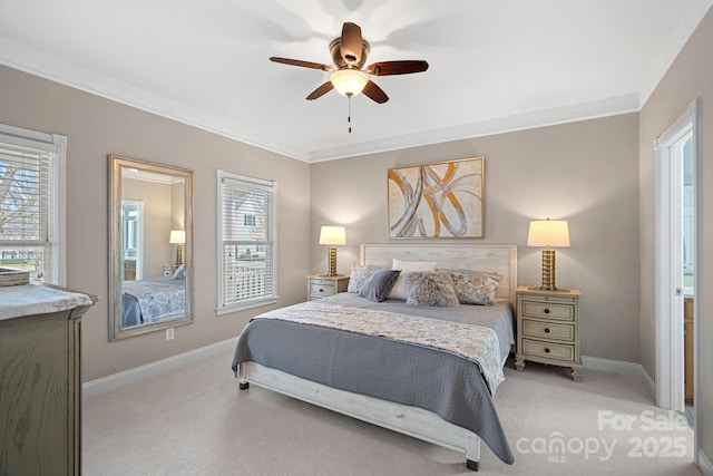 carpeted bedroom with ceiling fan, ornamental molding, and multiple windows