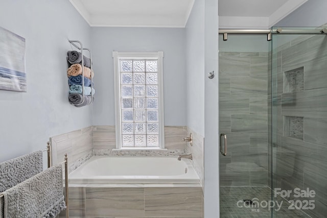 bathroom featuring crown molding and shower with separate bathtub