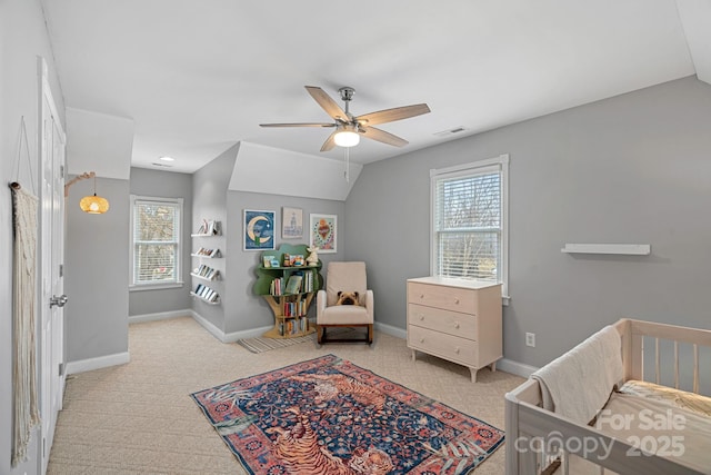 bedroom featuring ceiling fan, light colored carpet, and lofted ceiling