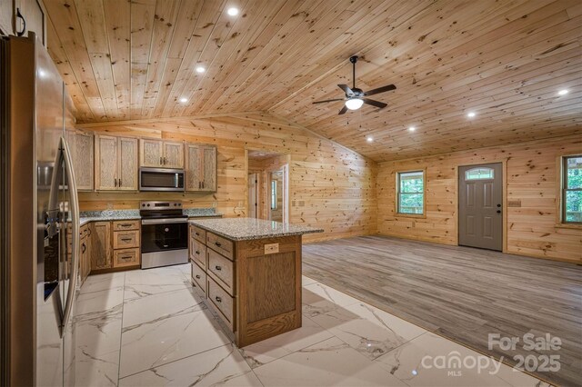 3161 Morganton Furniture Rd, Valdese, NC 28690 - kitchen featuring vaulted ceiling, appliances with stainless steel finishes, wooden walls, and wooden ceiling