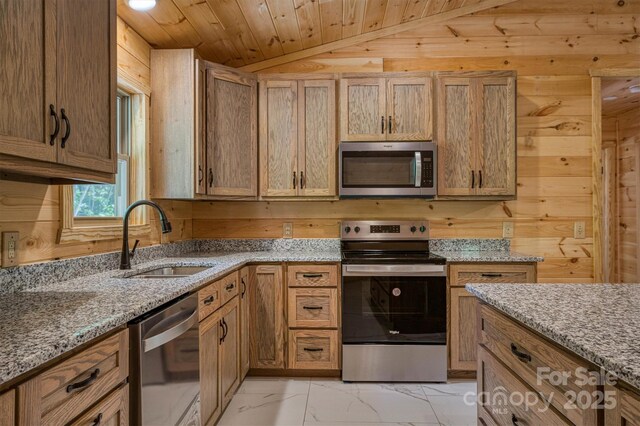 3161 Morganton Furniture Rd, Valdese, NC 28690 - kitchen with appliances with stainless steel finishes, a sink, marble finish floor, wooden walls, and lofted ceiling